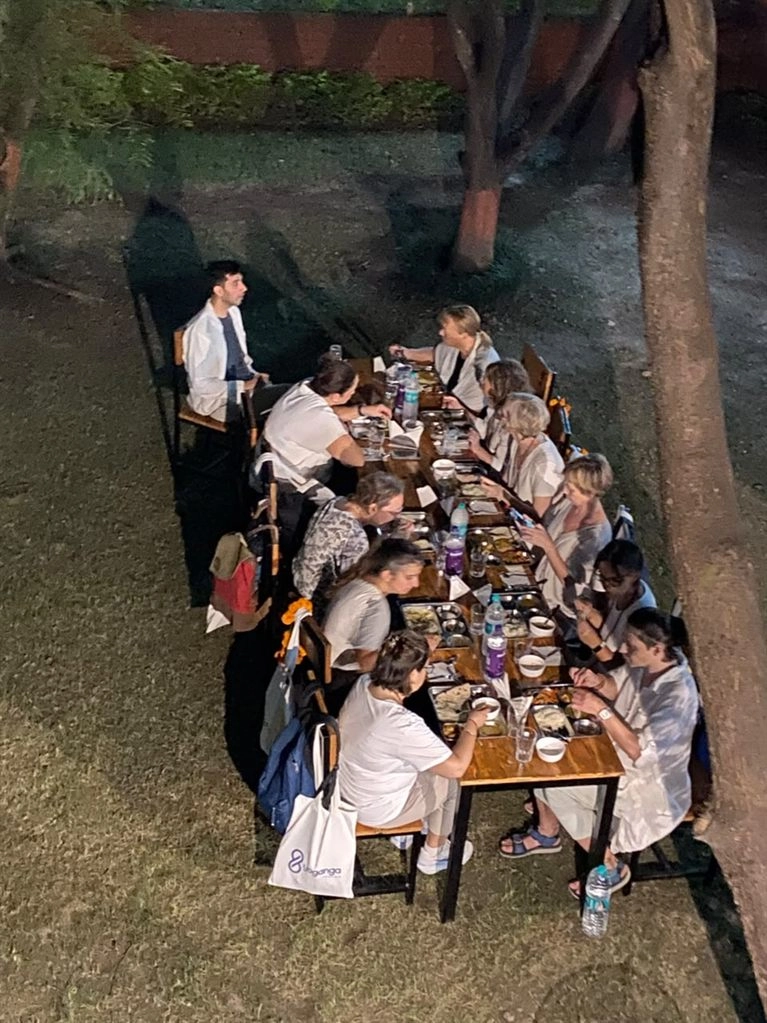 Students at dinner together at Tattvaa Yogashala