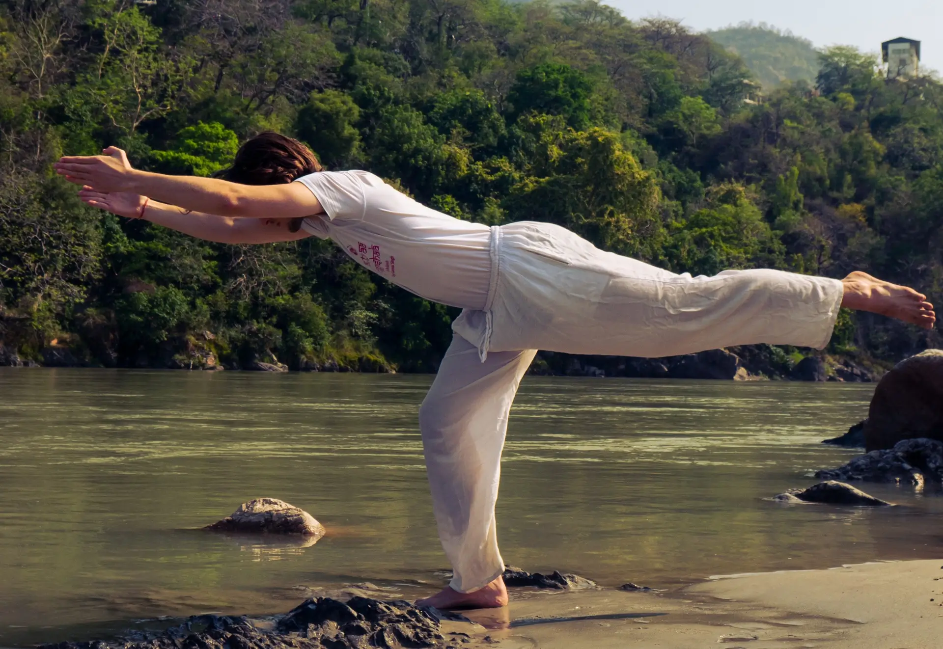 Yoga practice on the bank of the Ganges at Rishikesh, India