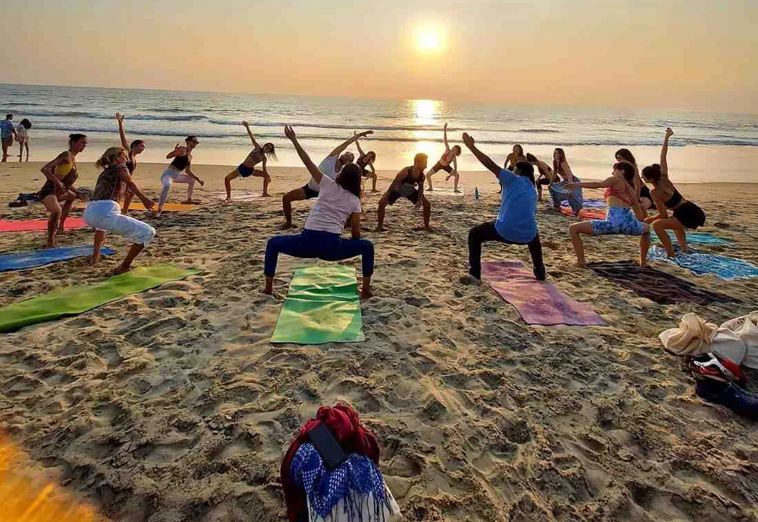 Yoga Students Practicing On The Beach In Goa