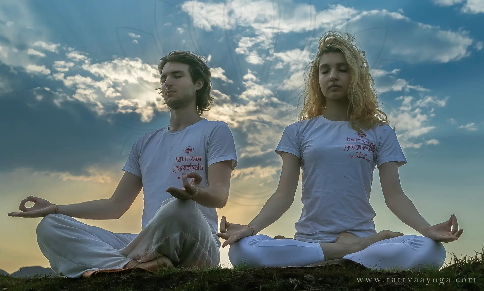 Two students meditating in lotus pose at Tattvaa Yogashala, Rishikesh