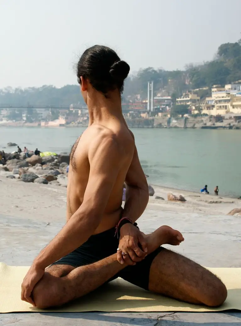 Seated Ashtanga practice on the bank of the Ganges at Rishikesh