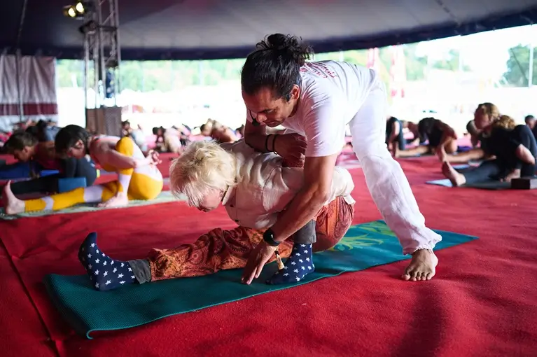 Yogi Kamal adjusting a student at Tattvaa Yogashala