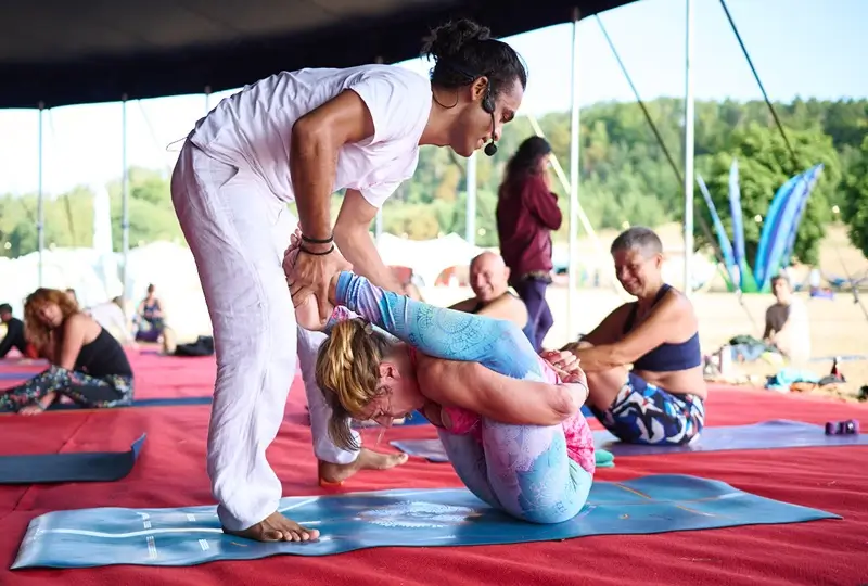 An adjustment given during a multistyle class on the 200 hour yoga teacher training at Tattvaa Yogashala, Rishikesh