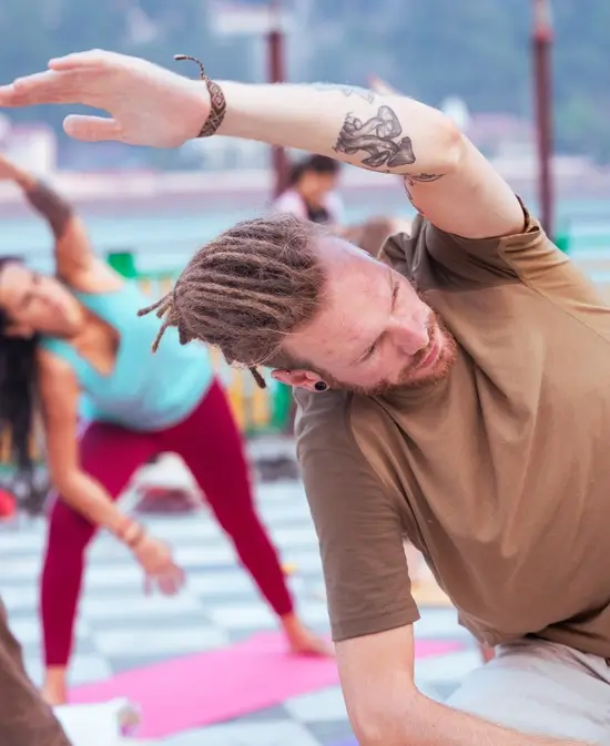 Adjustment during a class on the 200 hour yoga teacher training at Tattvaa Yogashala, Rishikesh
